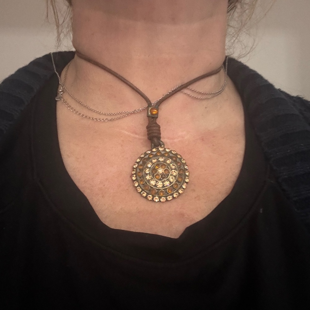 Brown leather necklace with rhinestone pendant